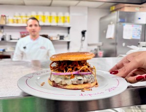 chef Eliott Azoulay at Bar Sardine cooking a burger