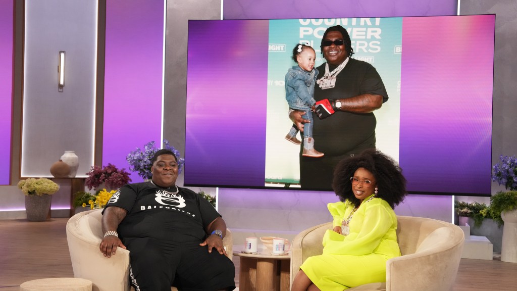 Two people talking about fatherhood