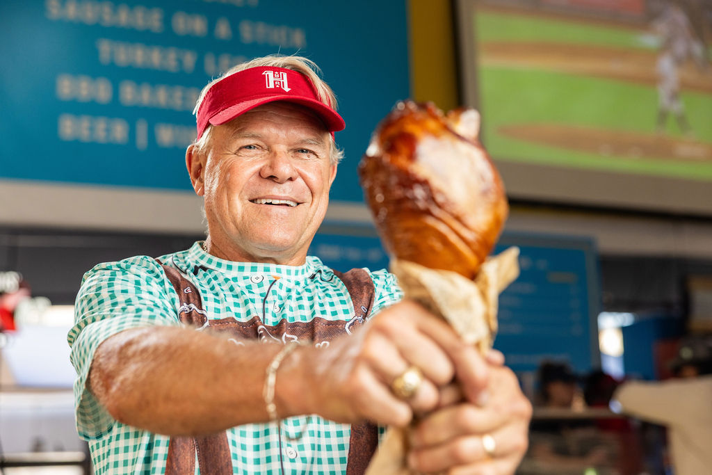 man holding turkey leg