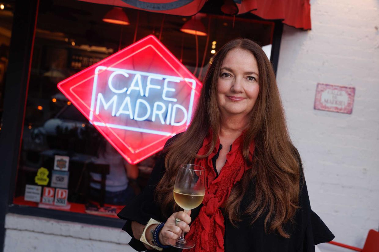 woman in front of sign