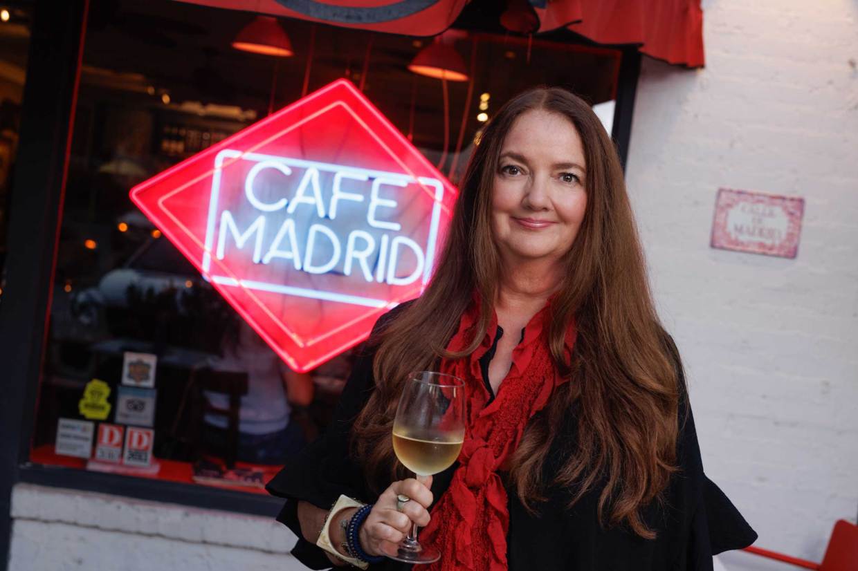 woman in front of sign