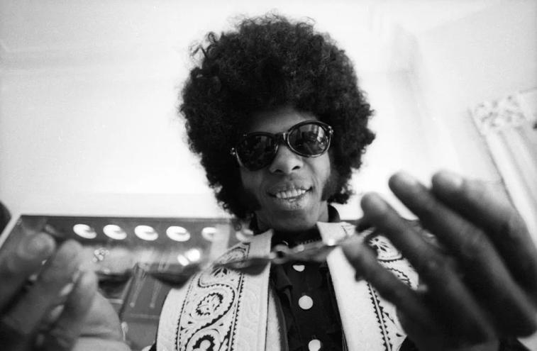 Man trying on a necklace