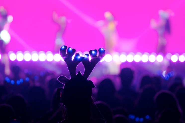 Man in reindeer lighted antlers at Jingle Ball in Fort Worth.