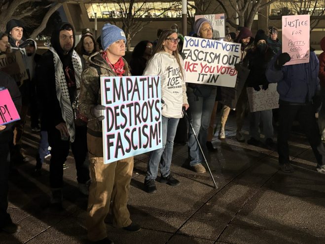 Anti-ICE protesters with signs