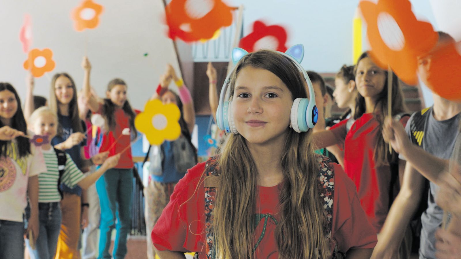 young girl with headphones in film