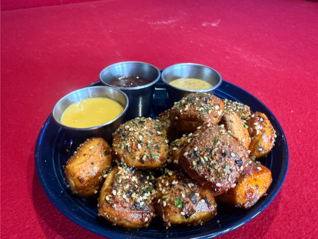 Rising Tides' umami pretzels, served with ponzu butter and savory seasoning.