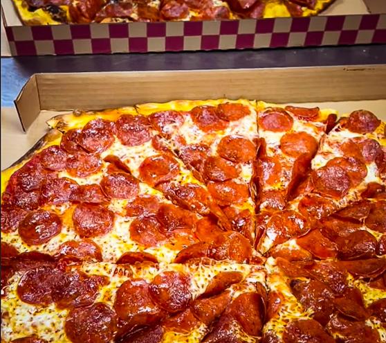 Burattino Brick Oven pepperoni pizza in a to go box.