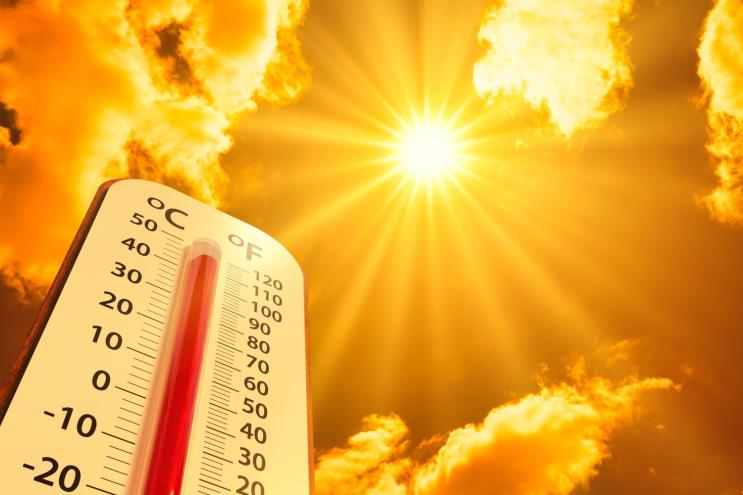 thermometer and sun showing high outdoor temperature