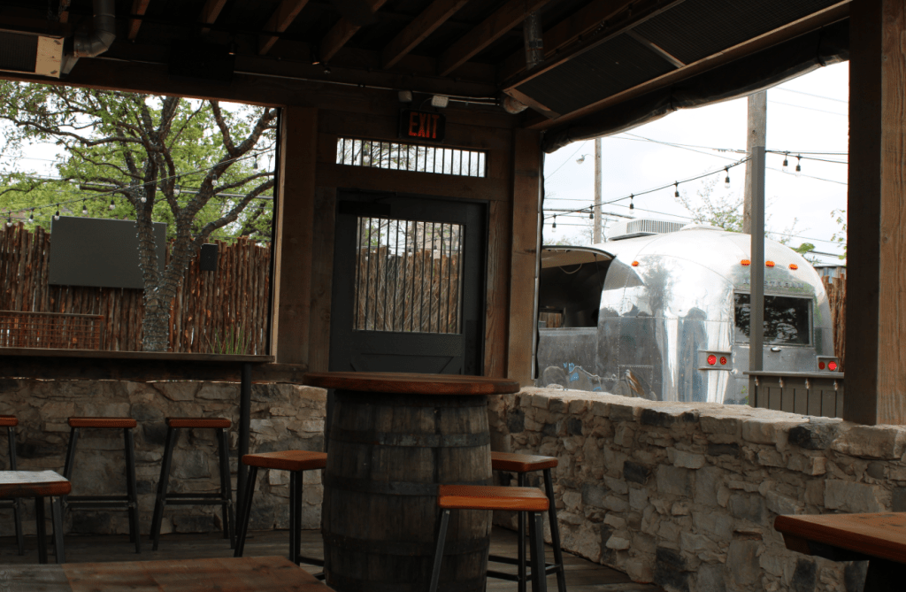 The courtyard at Kilmac's with an Airstream trailer.