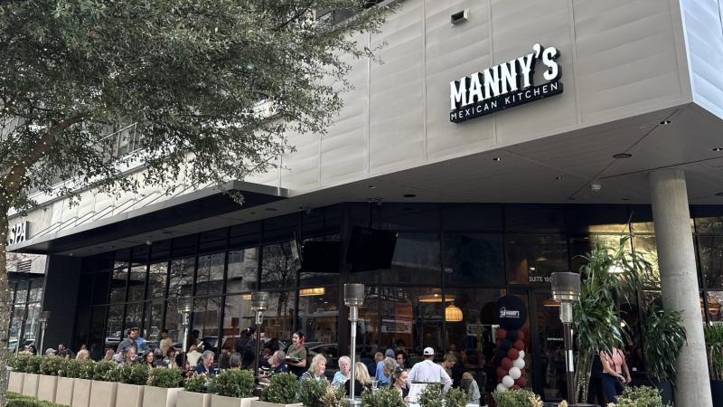 Exterior a people-filled patio of Manny's Mexican Kitchen in Richardson.