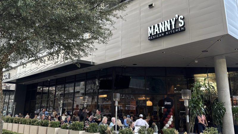 Exterior a people-filled patio of Manny's Mexican Kitchen in Richardson.