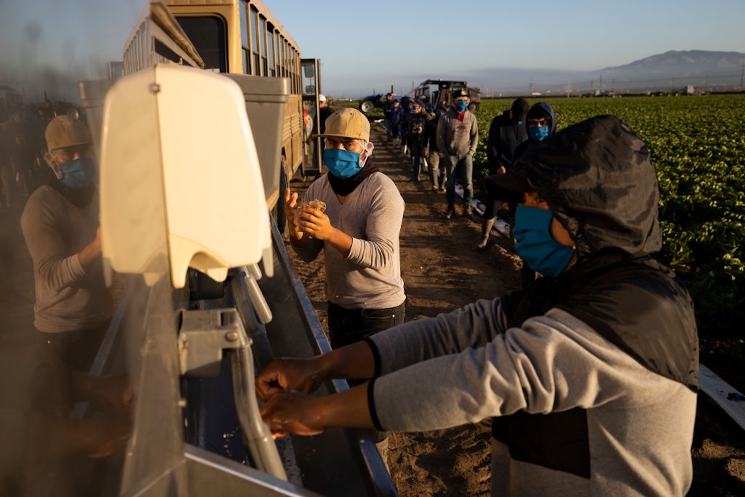 GREENFIELD, CA - APRIL 28: Farm laborers with Fresh Harvest wash their hands before work on April 28, 2020 in Greenfield, California. (Photo by Brent Stirton/Getty Images)