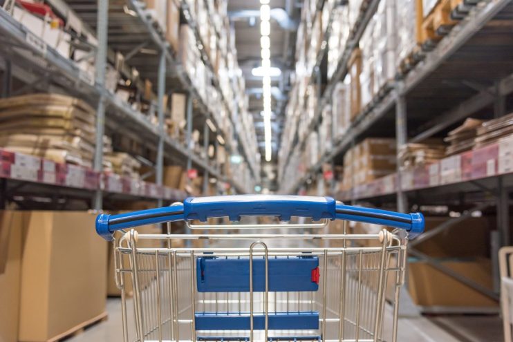 Shopping cart in a wholesale club aisle