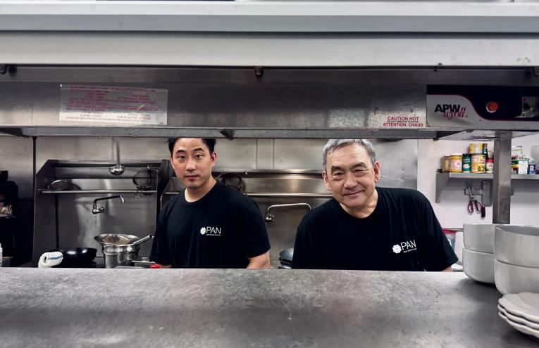 Howard Wang and his son Jarren in the kitchen.