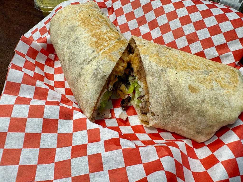 a breakfast burrito from Susans cut in half
