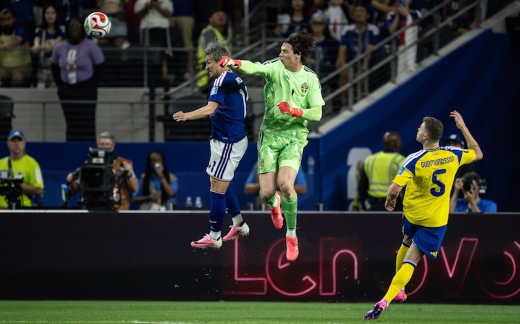 Daizen Maeda of Japan and Sweden's goalkeeper in the world cup