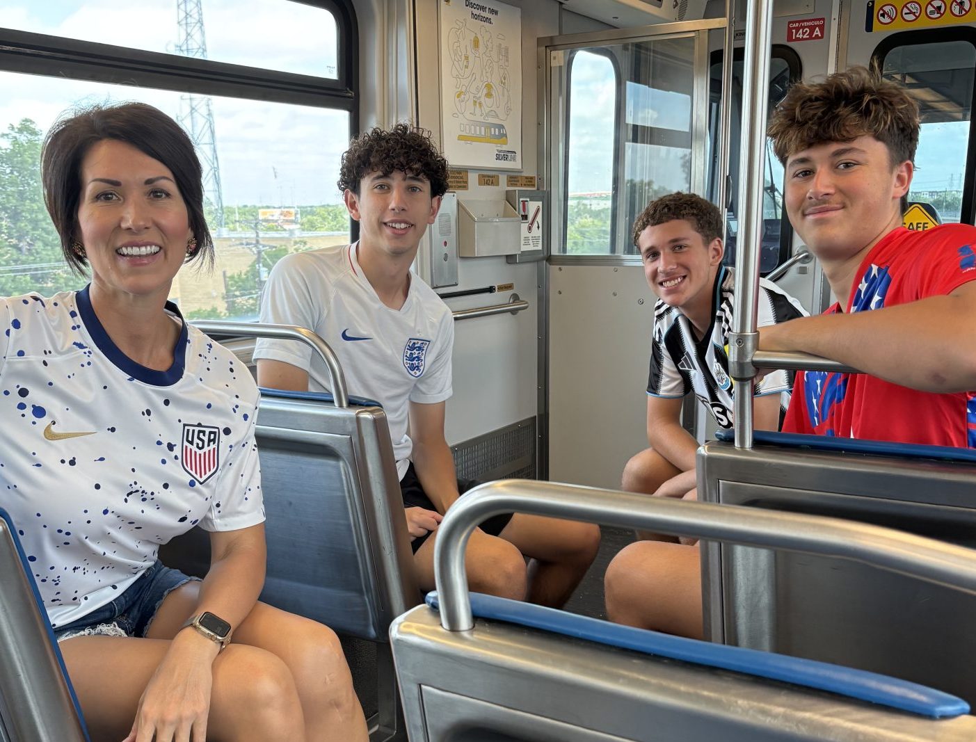 family on DART train to World Cup in Dallas