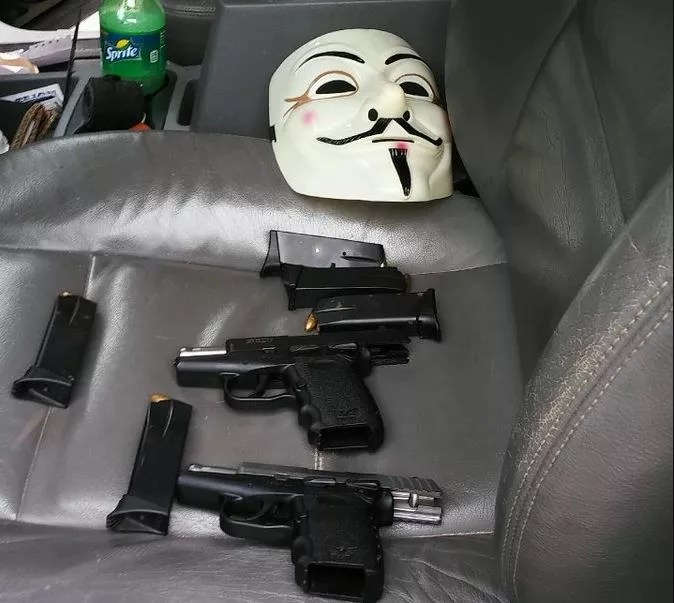 Man Arrested With Guy Fawkes Mask, Guns and Weed at DPD Substation Now Faces Federal Charges