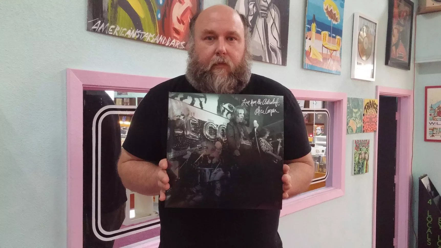 Man holding record in a store