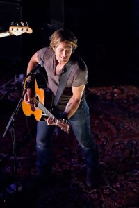 Keith Urban and his guitar onstage in Dallas.