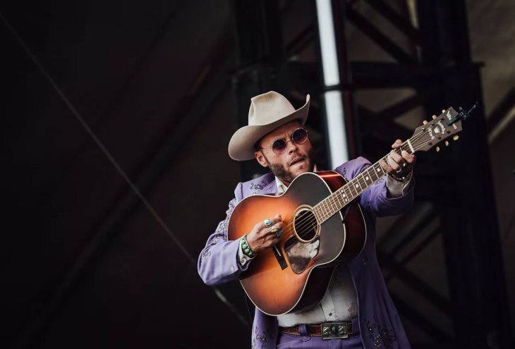 Photo of man playing guitar