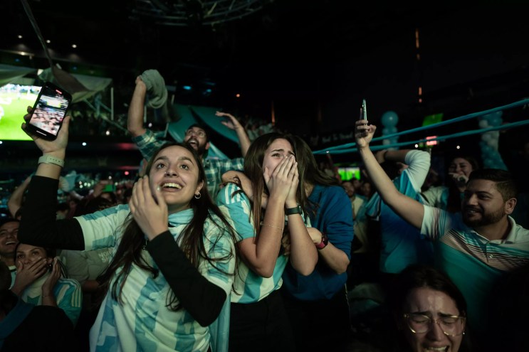 soccer fans celebrating at a restaurant