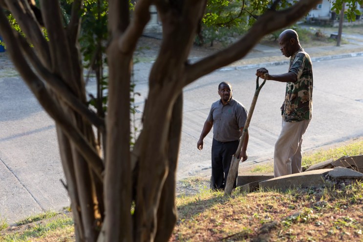 Tenth Street homeowners Larry Johnson and Benny Harris at work in their historic Dallas neighborhood.