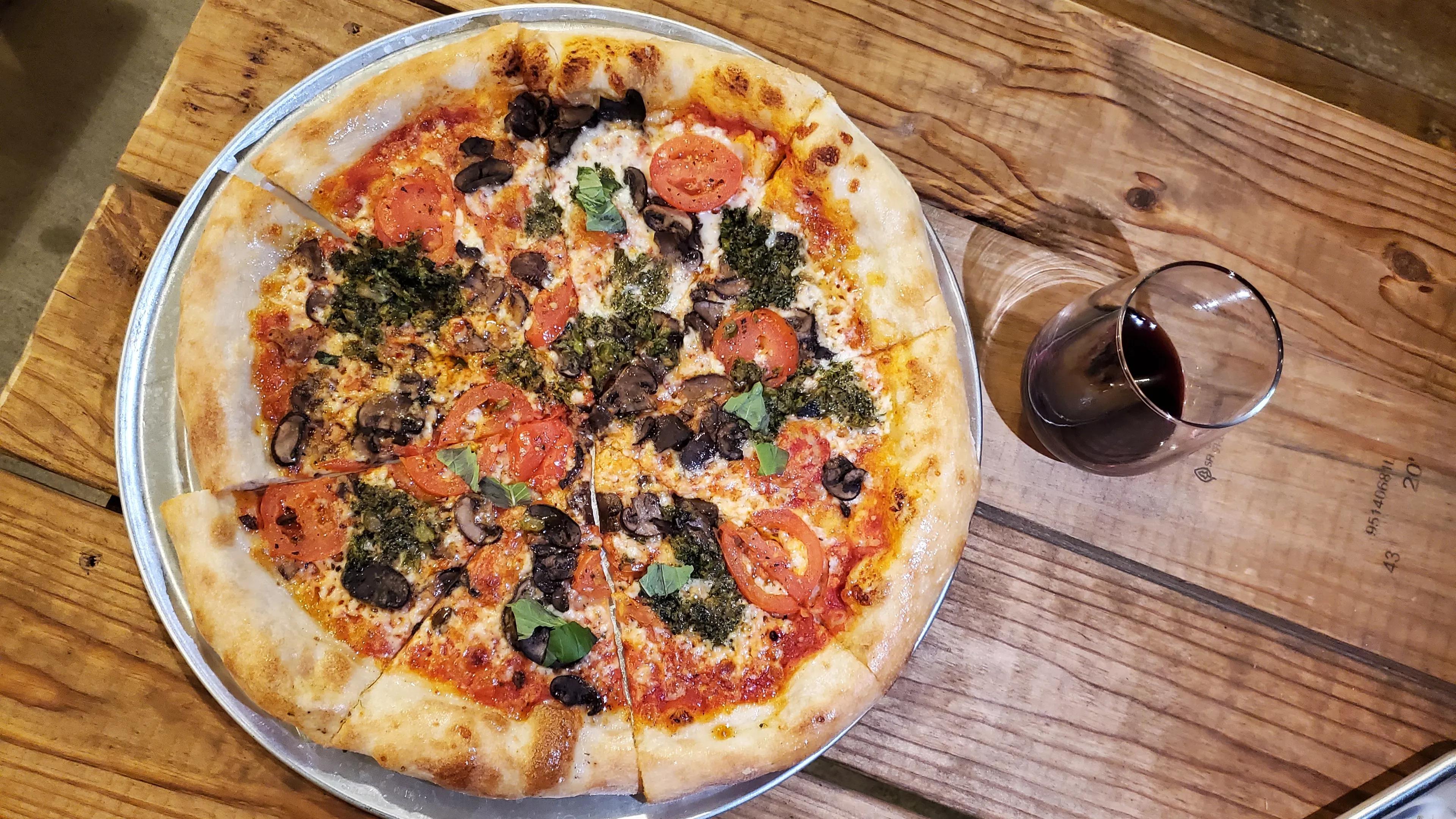 Cenzo's pizza and glass of wine