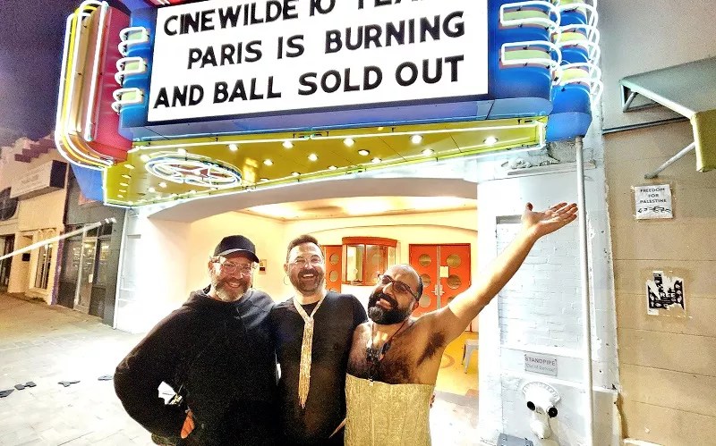 CinéWilde organizers stand in front of the Texas Theatre in Dallas. The film series has celebrated LGBTQ plus film for 10 years.