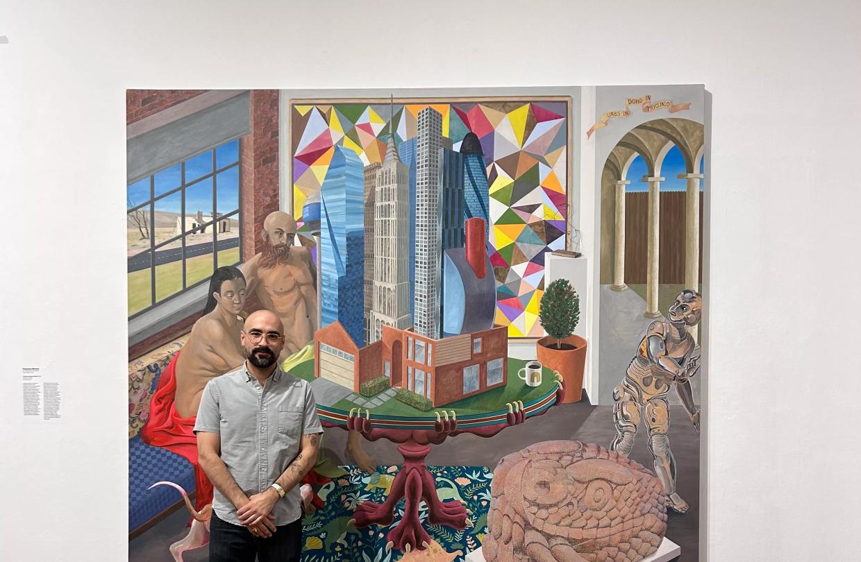 Artist Francisco Moreno with the history painting “A city in a house in a room” at Soy de Tejas in Arts Fort Worth.