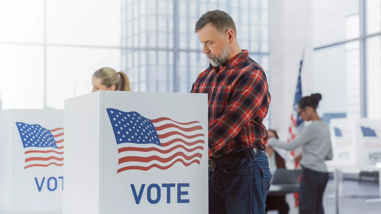 man at an election voting booth