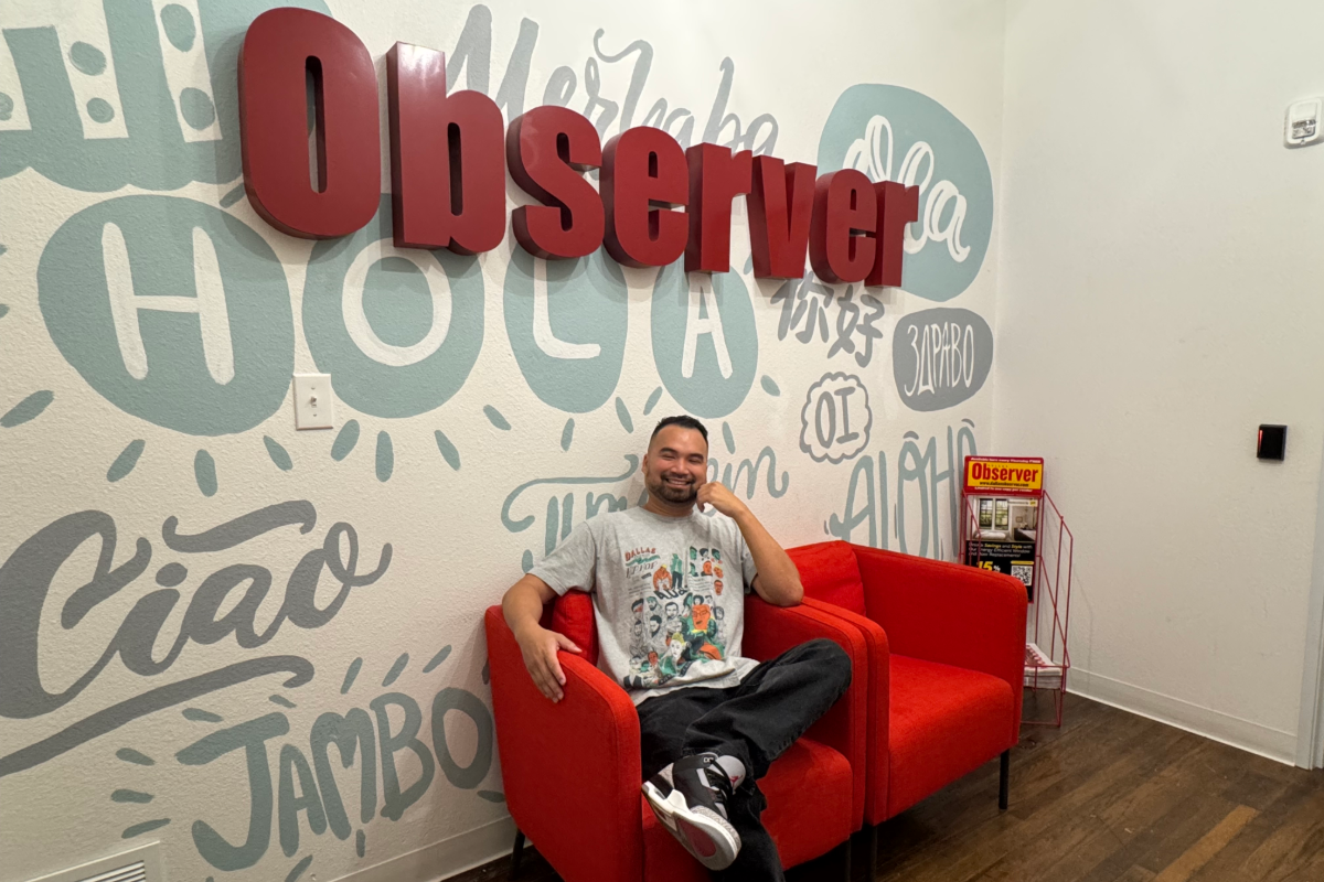 Man sitting on red chair in an office