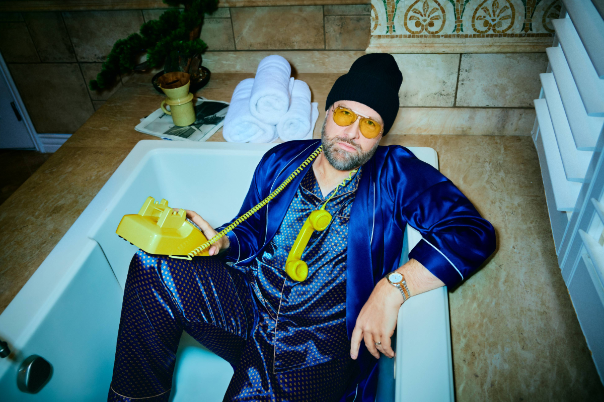 Man in tub with yellow phone