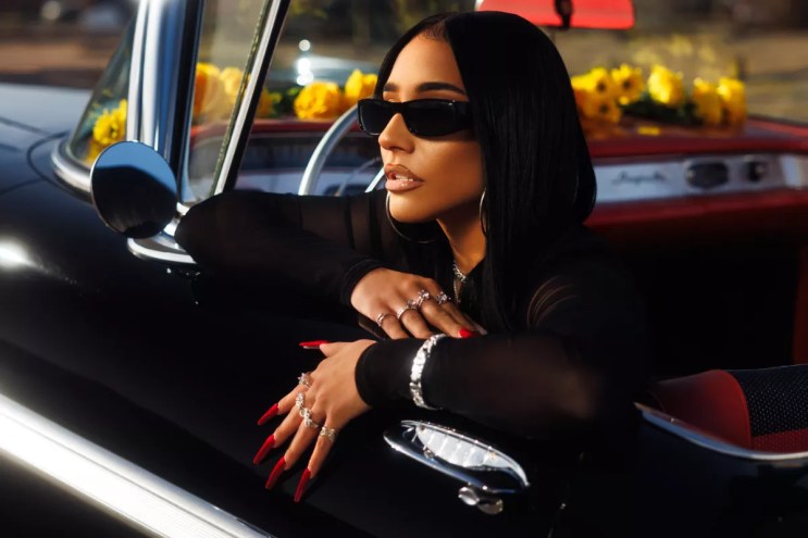 Woman posing in a car