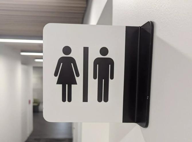 airport male and female bathroom sign